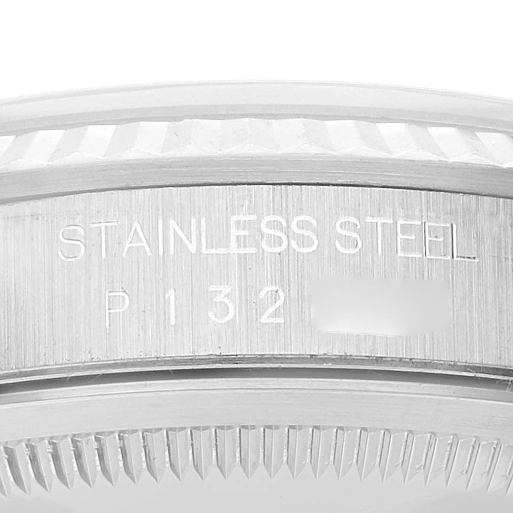 The image shows a close-up of the stainless steel case back and case band of a Rolex Datejust 16234 Men's Stainless Steel Blue Dial 16234 Men's Stainless Steel Blue Dial watch, including the serial number.