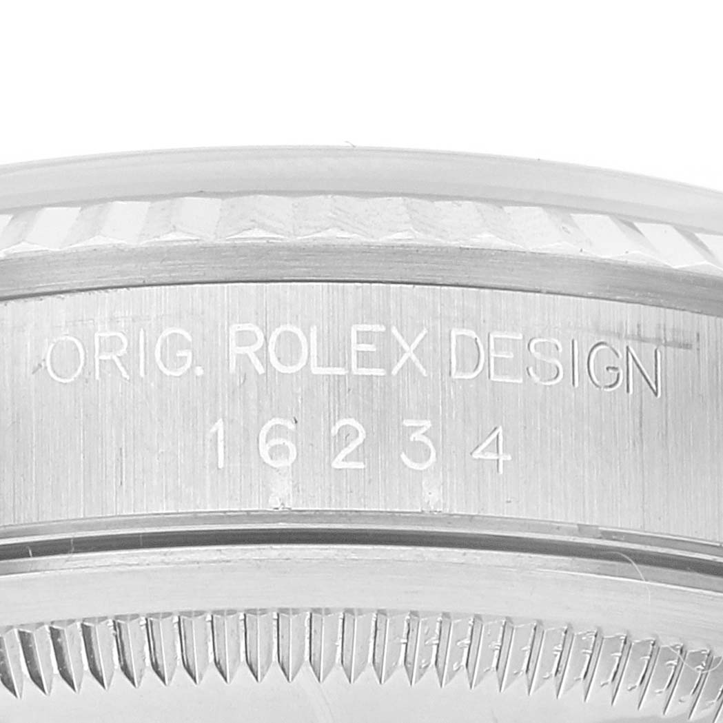This close-up image of the Rolex Datejust 16234 Men's Stainless Steel Blue Dial 16234 Men's Stainless Steel Blue Dial watch shows the side case engraving with the model number "16234".