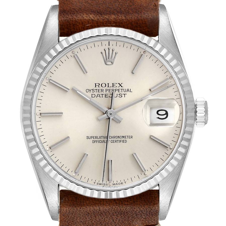 The image shows a front view of a Rolex Datejust watch, highlighting its dial, bezel, and crown, with a brown leather strap.