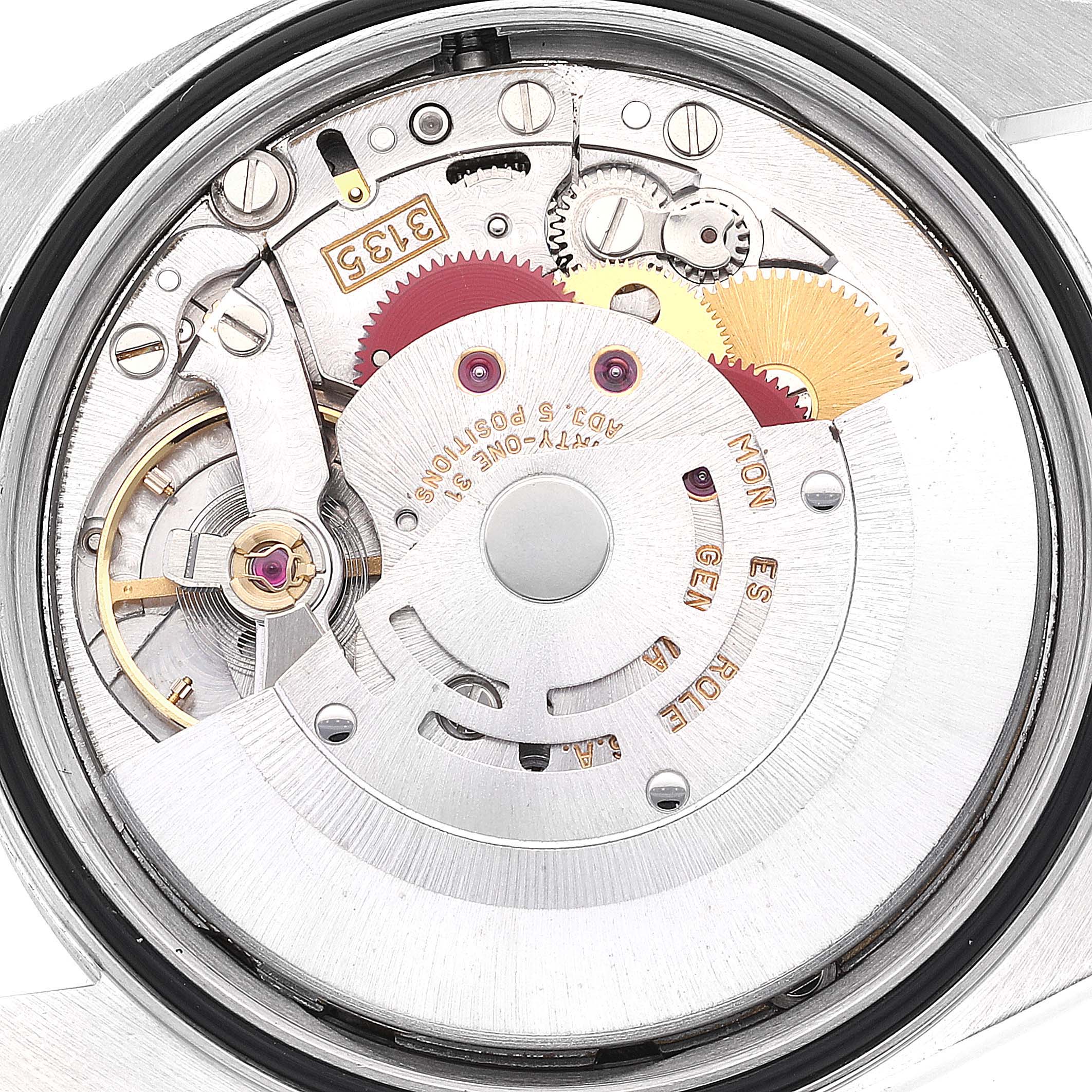 The image shows the internal mechanism of the Rolex Datejust 16234 Men's Stainless Steel Silver Dial 16234 Men's Stainless Steel Silver Dial watch, highlighting gears and the rotor.
