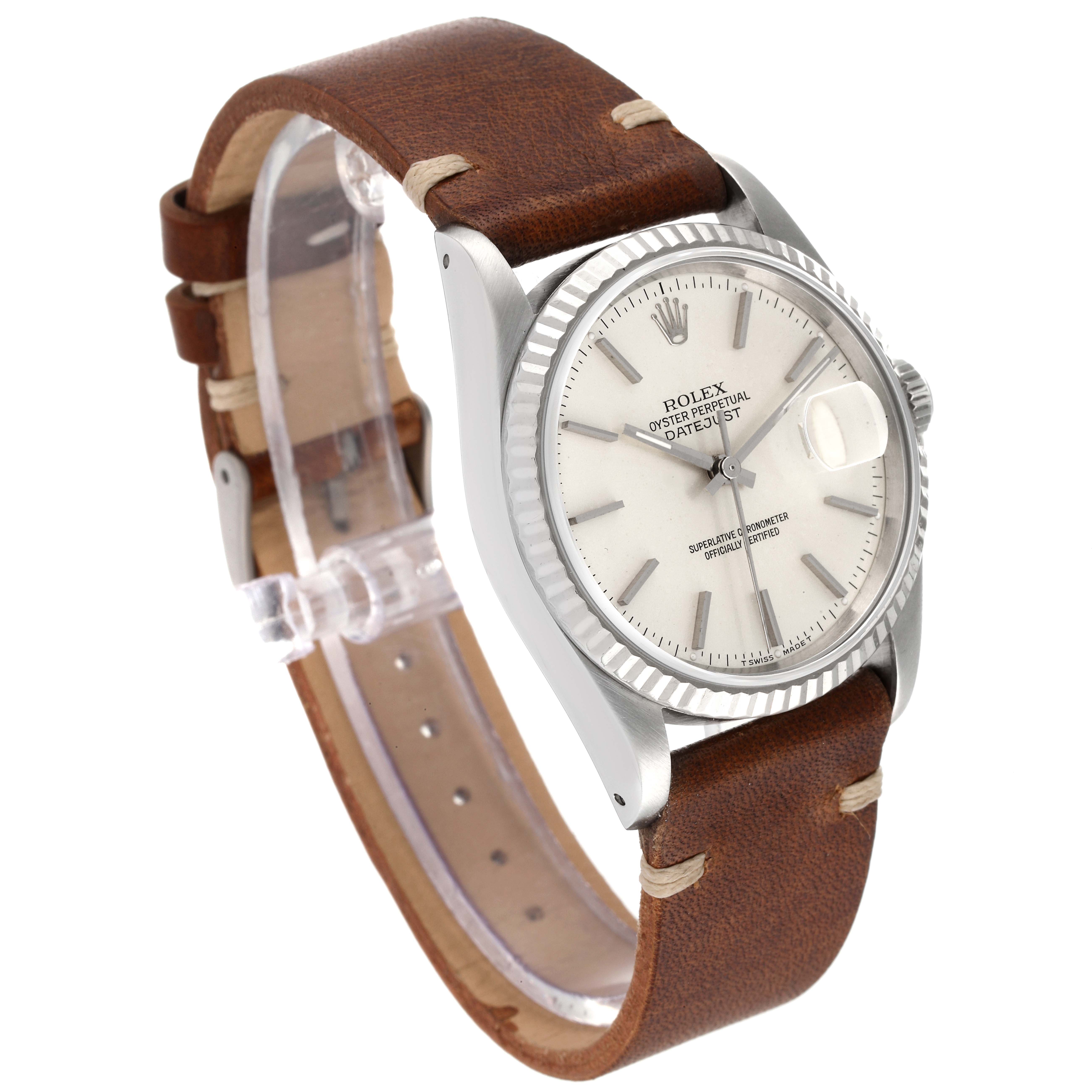 This image shows a Rolex Datejust 16234 Men's Stainless Steel Silver Dial 16234 Men's Stainless Steel Silver Dial watch from an angled side view, highlighting the dial, bezel, crown, and leather strap.