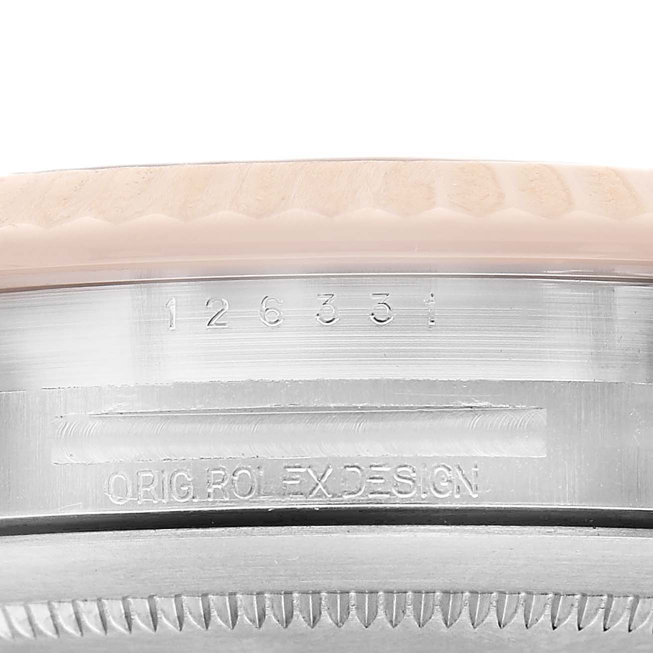 The image shows a close-up of the Rolex Datejust 41 126331 Men's Steel and Gold (two tone) Brown Dial's side, featuring its bezel and engraved model number.
