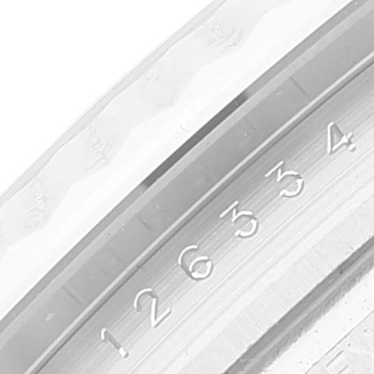 The image shows a close-up of the fluted bezel and part of the dial edge of a Rolex Datejust 41 126334 Men's Stainless Steel Blue Dial 126334 Men's Stainless Steel Blue Dial.