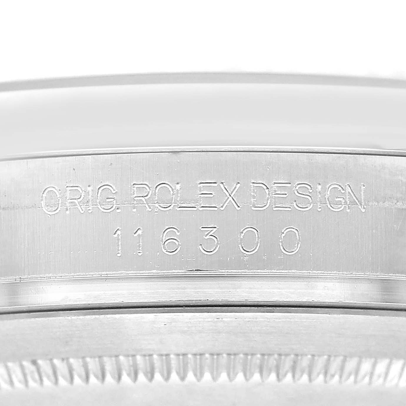 The image shows a close-up of the engraved side of a Rolex Datejust 41 116300 Men's Stainless Steel Blue Dial case, displaying its model number.