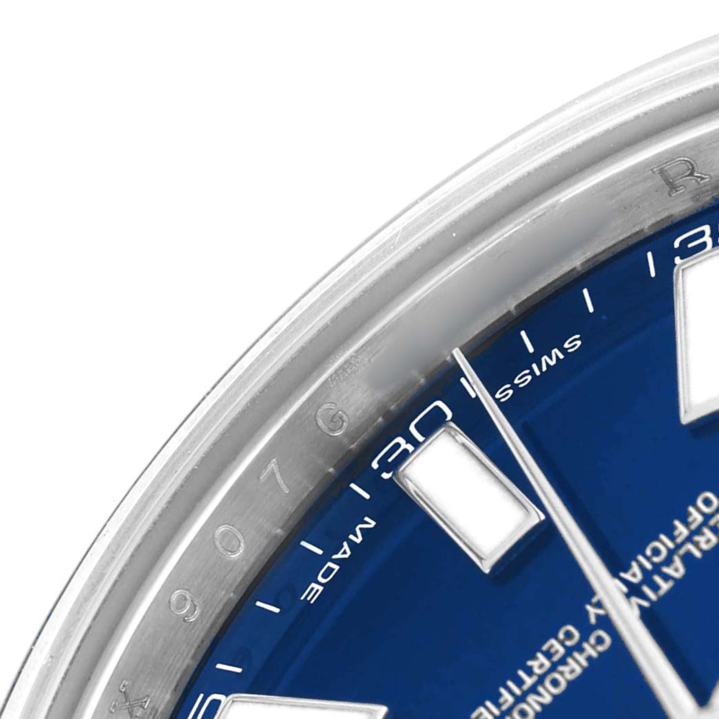 The image shows a close-up of the dial and bezel of a Rolex Datejust 41 116300 Men's Stainless Steel Blue Dial, highlighting the hour marker and part of the chapter ring.