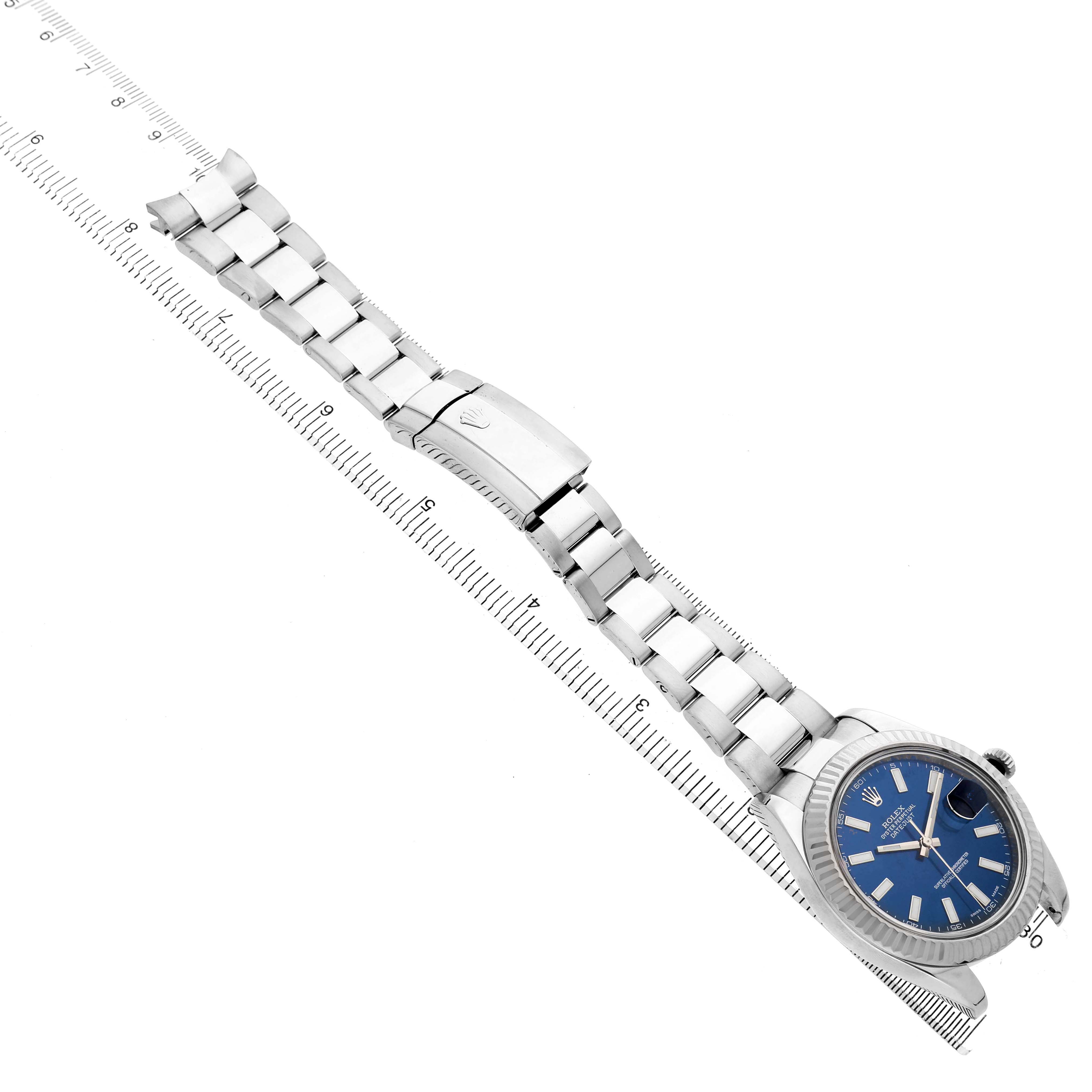 The Rolex Datejust 116334 Men's Stainless Steel Blue Dial watch is shown from a top-down angle, displaying its full bracelet, clasp, and dial.