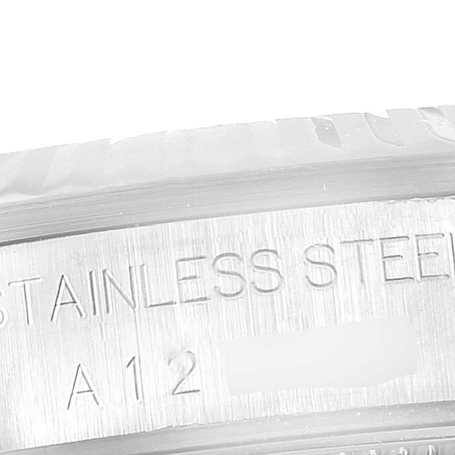 The image shows a close-up view of the side detail and engraving on a Rolex Mid-Size 68274 Women
s Stainless Steel Blue Dial 68274 Women
s Stainless Steel Blue Dial model
s stainless steel case.