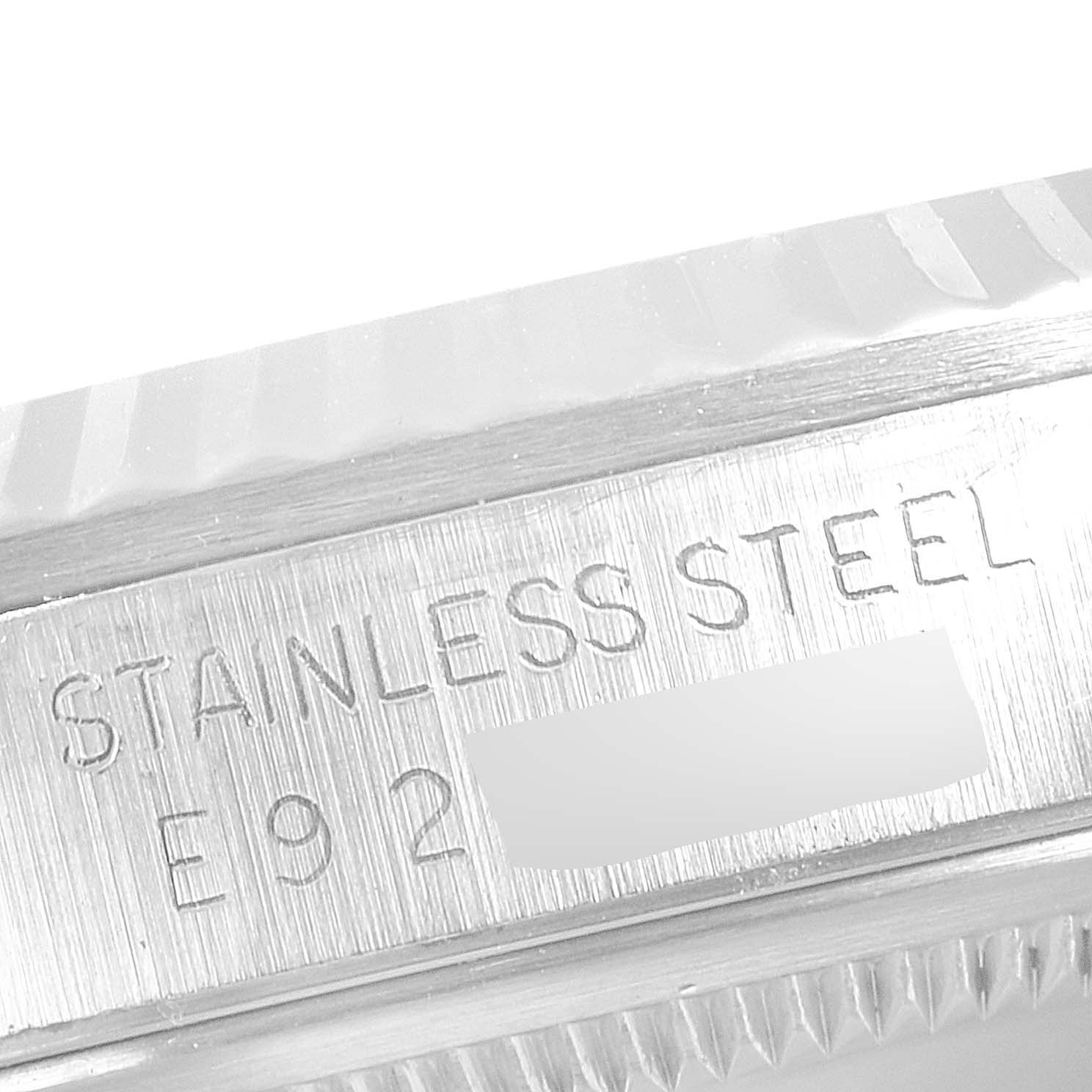 This image shows a close-up of the stainless steel casing and engraved serial number of a Rolex Datejust 16234 Men's Stainless Steel Silver Dial 16234 Men's Stainless Steel Silver Dial watch.