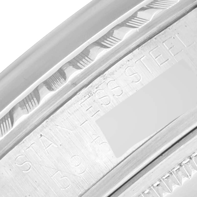 This image shows a close-up of the engraved stainless steel bezel and case band of the Rolex Vintage Collection 1603 Men's Stainless Steel Silver Dial 1603 Men's Stainless Steel Silver Dial model.