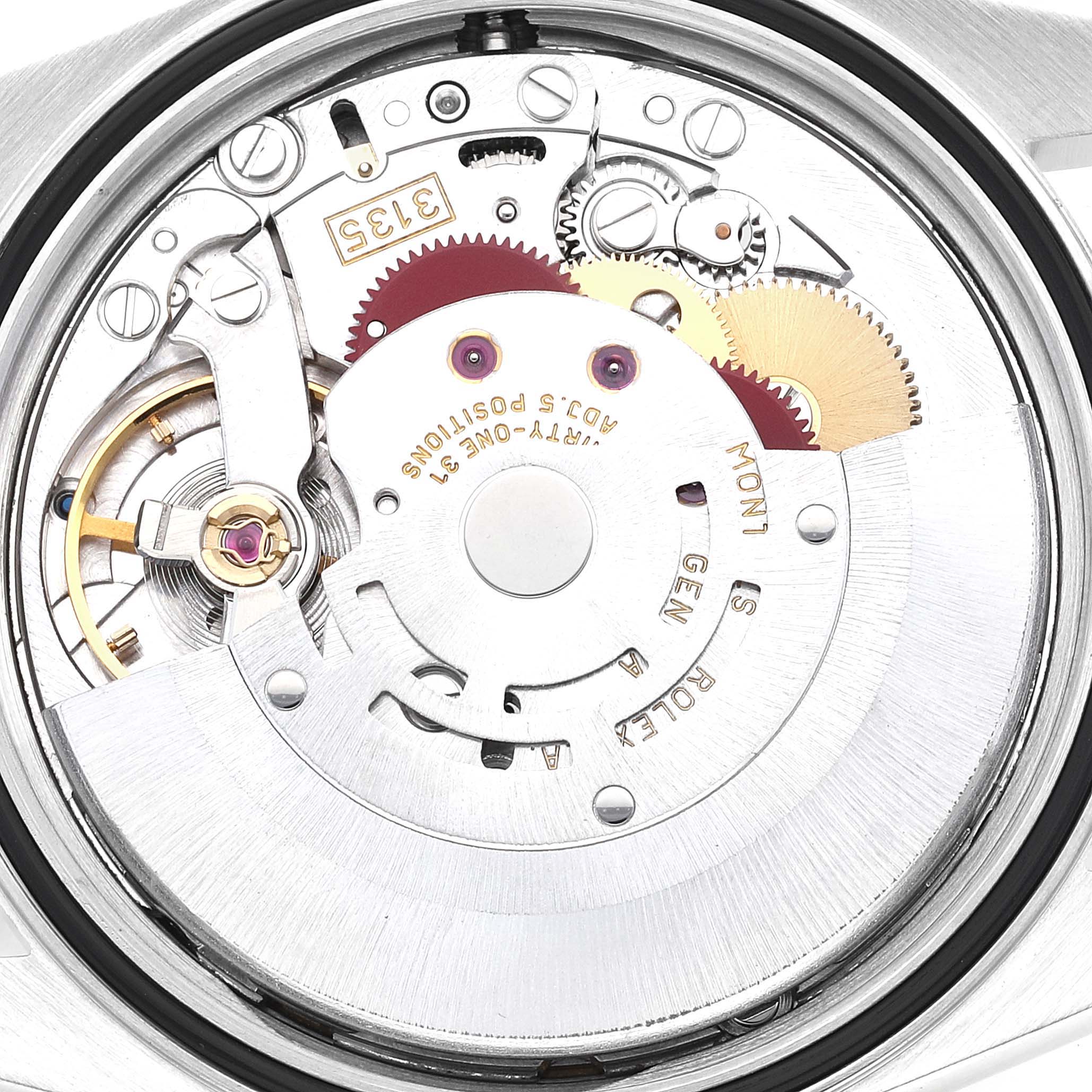 This image shows a close-up view of the Rolex Datejust 16233 Men's Steel and Gold (two tone) White Dial 16233 Men's Steel and Gold (two tone) White Dial watch's internal movement and gears.