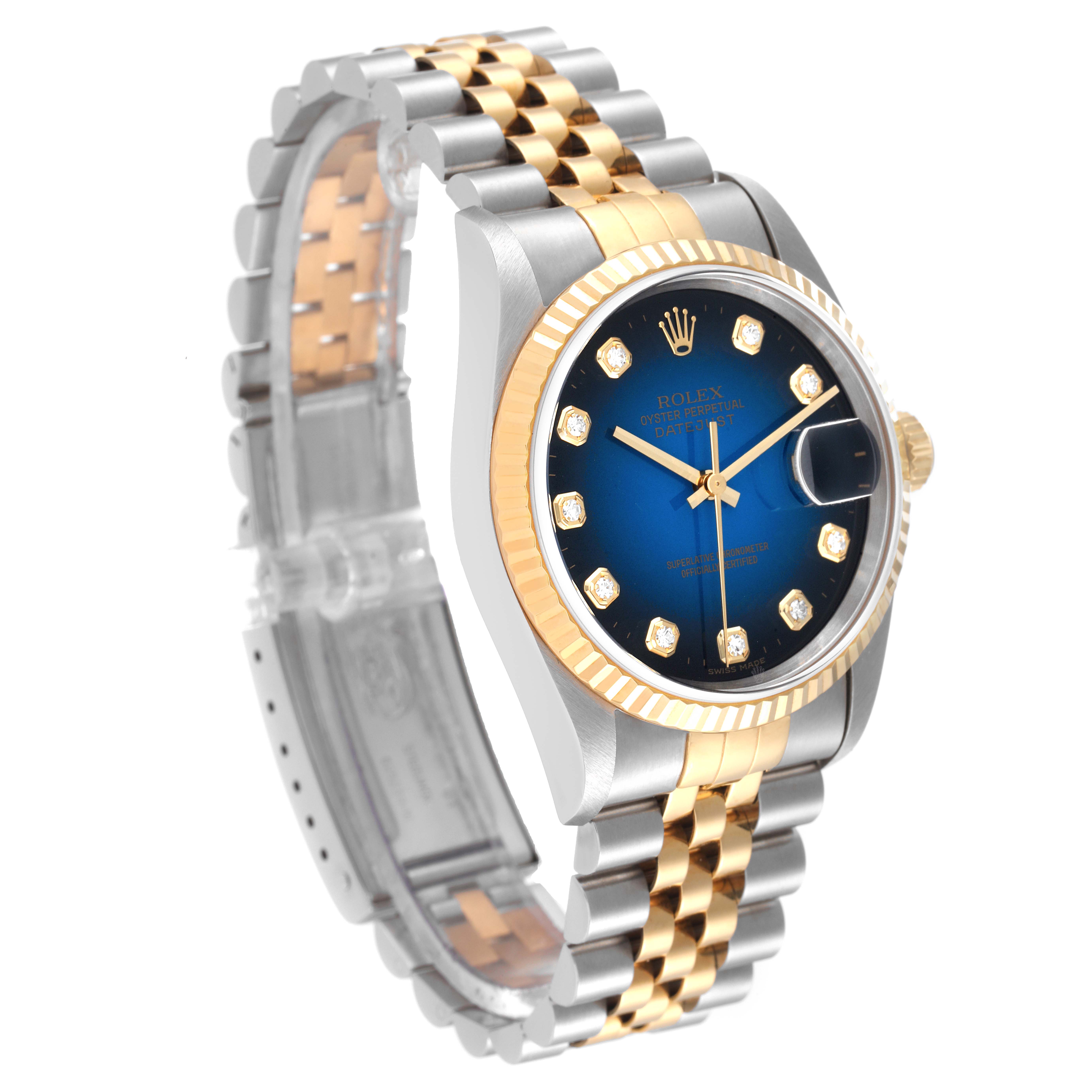 The image shows a Rolex Datejust 16233 Men's Steel and Gold (two tone) Blue Dial 16233 Men's Steel and Gold (two tone) Blue Dial watch at a three-quarter angle, highlighting its jubilee bracelet, blue dial, and gold fluted bezel.