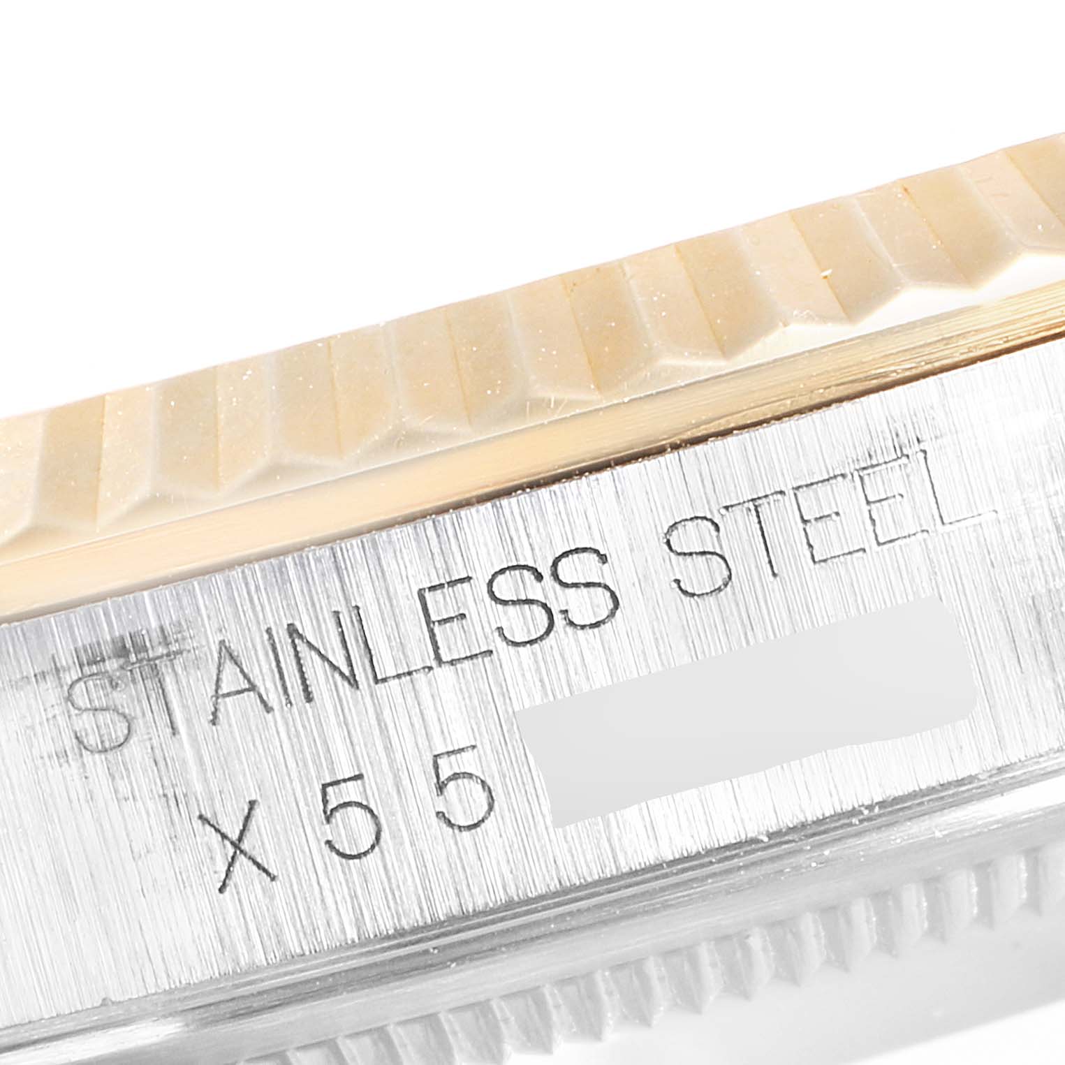 Close-up of the side of a Rolex Datejust 16233 Men
s Steel and Gold (two tone) Champagne Dial 16233 Men
s Steel and Gold (two tone) Champagne Dial watch, showing the stainless steel casing and model engraving.