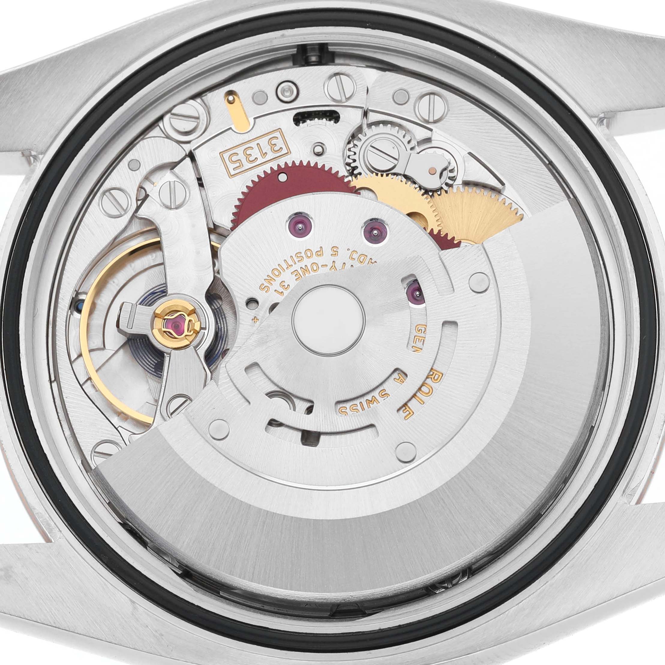 The image shows the movement of a Rolex Datejust 116231 Men's Steel and Gold (two tone) Mother of Pearl Dial watch, viewed from the back, highlighting the intricate internal components.