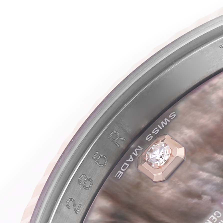 The image shows a close-up of a diamond hour marker and the edge of the dial on a Rolex Datejust 116231 Men's Steel and Gold (two tone) Mother of Pearl Dial watch.