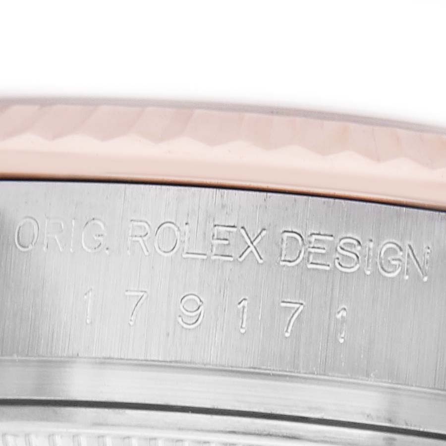 The image shows the side engraving on a Rolex Datejust 179171 Women's Stainless Steel Pink Dial watch, featuring "ORIG. ROLEX DESIGN" and a model number.