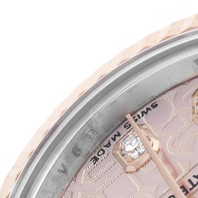 The image shows a close-up of the Rolex Datejust 179171 Women's Stainless Steel Pink Dial watch face, highlighting the bezel, a diamond marker, and partial dial details.