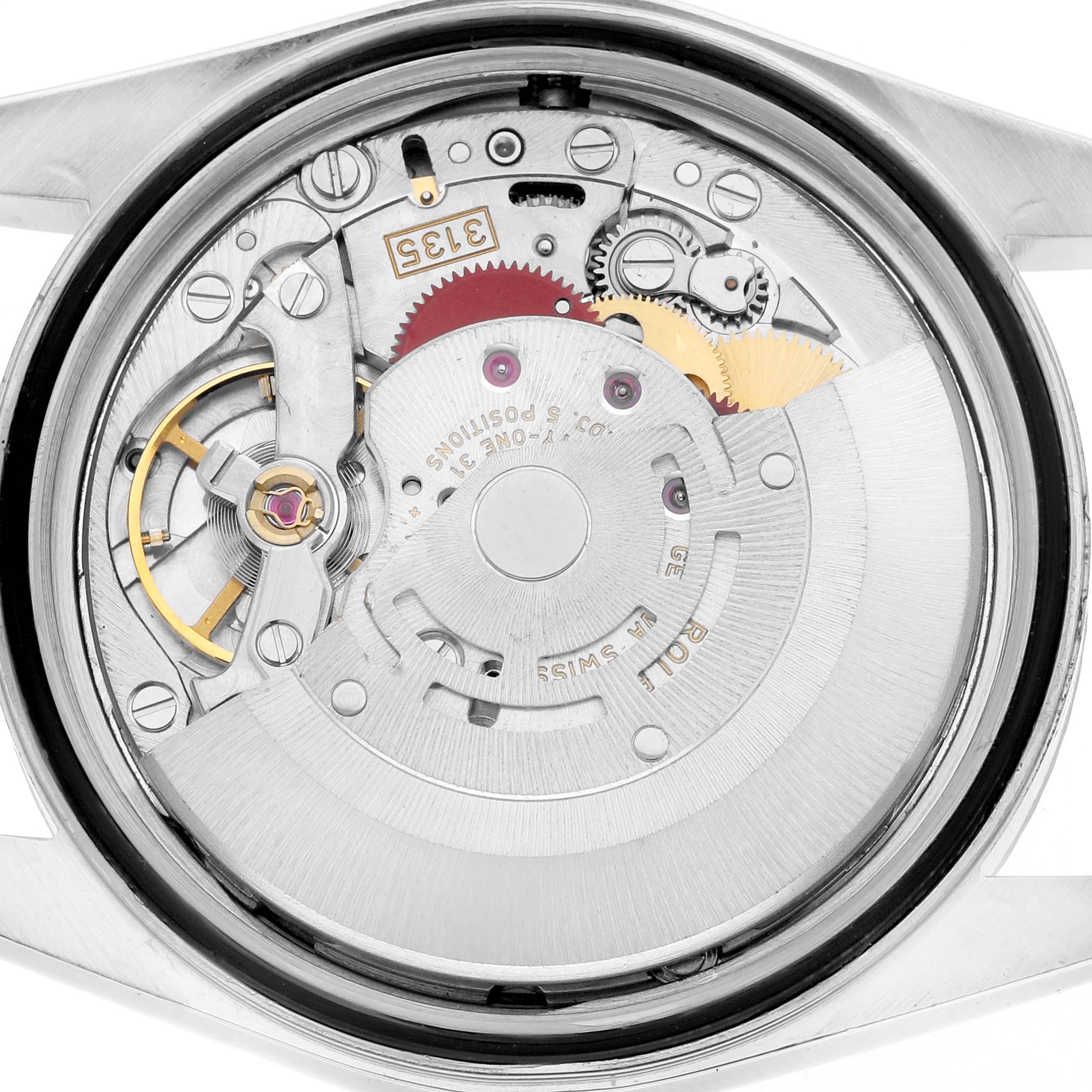The image shows the movement of a Rolex Datejust 16234 Men
s Stainless Steel Black Dial watch from a back view, displaying gears and components.