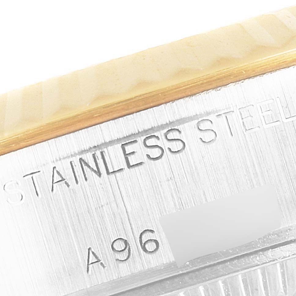 This image shows a close-up angle of the side of a Rolex Datejust 79173 Women's Steel and Gold (two tone) Blue Dial 79173 Women's Steel and Gold (two tone) Blue Dial watch, focusing on the stainless steel part and serial engraving.