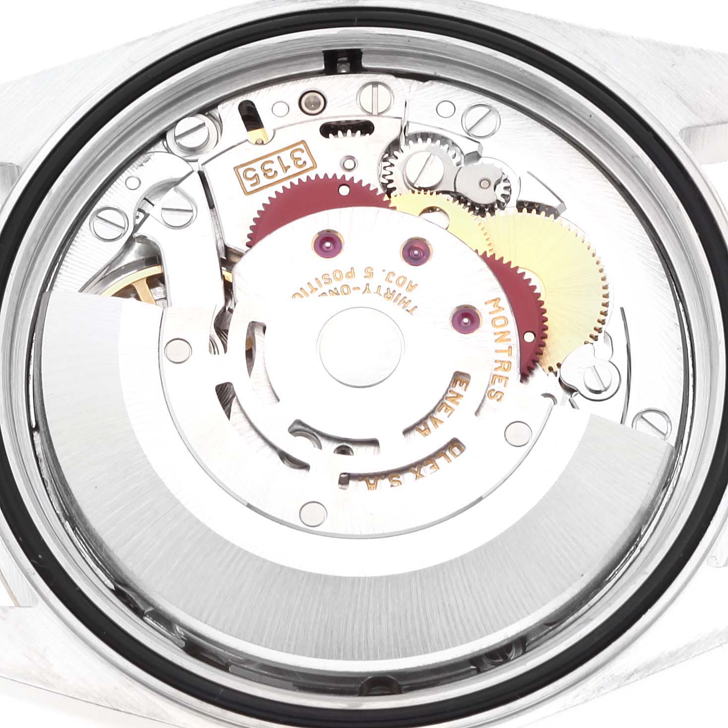 This is an internal view of the Rolex Datejust 16233 Men's Steel and Gold (two tone) Champagne Dial 16233 Men's Steel and Gold (two tone) Champagne Dial watch, showing the intricate movement and gears.