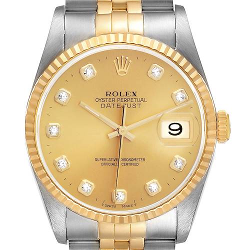 This image shows a Rolex Datejust watch from a front angle, highlighting its gold dial, date window, and two-tone bracelet.