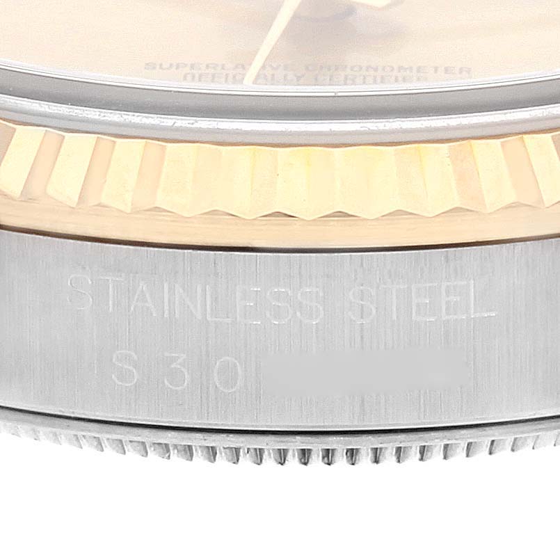 The image shows a close-up of the bezel and casing of a Rolex Datejust 16233 Men's Steel and Gold (two tone) Champagne Dial 16233 Men's Steel and Gold (two tone) Champagne Dial watch, highlighting the text "STAINLESS STEEL."