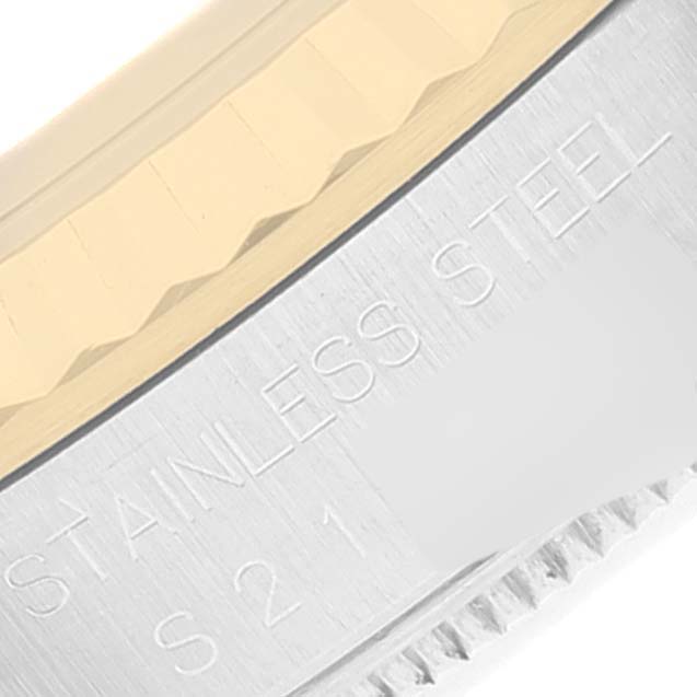 The image shows a close-up of the bezel and case side of a Rolex Datejust 16233 Men's Steel and Gold (two tone) Champagne Dial 16233 Men's Steel and Gold (two tone) Champagne Dial watch, highlighting the stainless steel and text engraving.