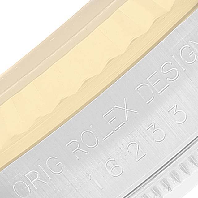 This close-up image shows the side of the bezel and engraved details on the case of a Rolex Datejust 16233 Men's Steel and Gold (two tone) Champagne Dial 16233 Men's Steel and Gold (two tone) Champagne Dial watch.