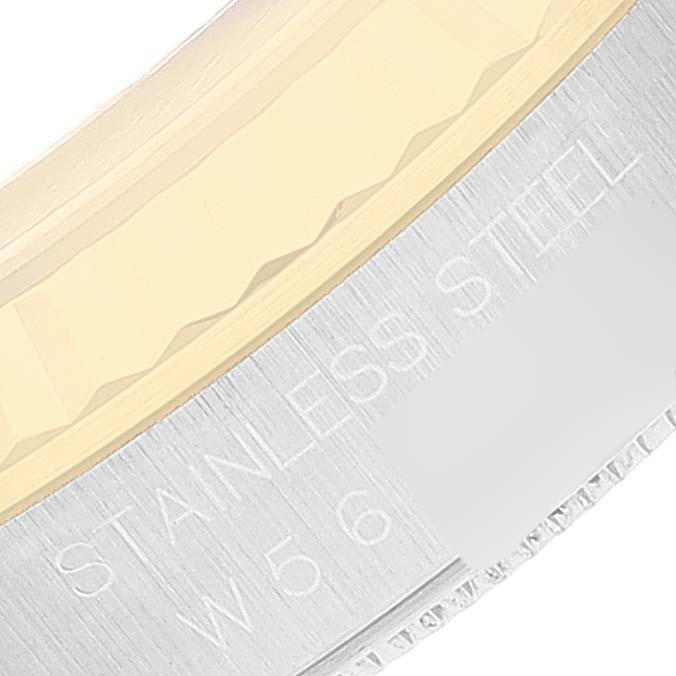 This image shows a close-up angle of the bezel and engraved text on a Rolex Datejust 16233 Men's Steel and Gold (two tone) Champagne Dial 16233 Men's Steel and Gold (two tone) Champagne Dial watch.