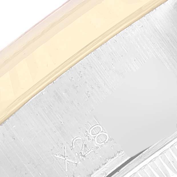 This image shows a close-up of the side detailing and serial number of a Rolex Datejust 69173 Women's Steel and Gold (two tone) Champagne Dial 69173 Women's Steel and Gold (two tone) Champagne Dial watch.