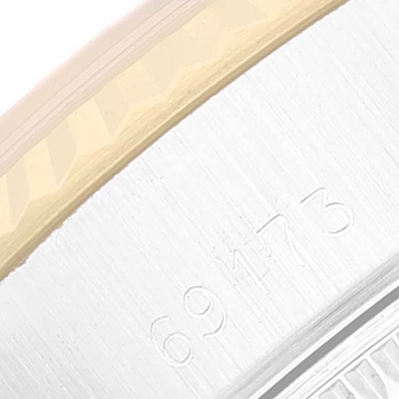 The image shows a close-up of the side of a Rolex Datejust 69173 Women's Steel and Gold (two tone) Champagne Dial 69173 Women's Steel and Gold (two tone) Champagne Dial watch, highlighting its serial number engraving.