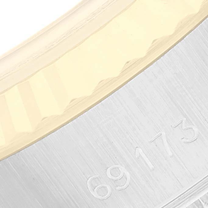 Close-up of the bezel and engraved model number "69173" of a Rolex Datejust 69173 Women's Steel and Gold (two tone) Champagne Dial 69173 Women's Steel and Gold (two tone) Champagne Dial watch.