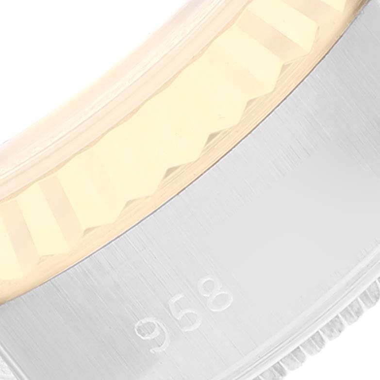 This close-up image shows the bezel and part of the case of a Rolex Datejust 69173 Women's Steel and Gold (two tone) Champagne Dial 69173 Women's Steel and Gold (two tone) Champagne Dial watch.