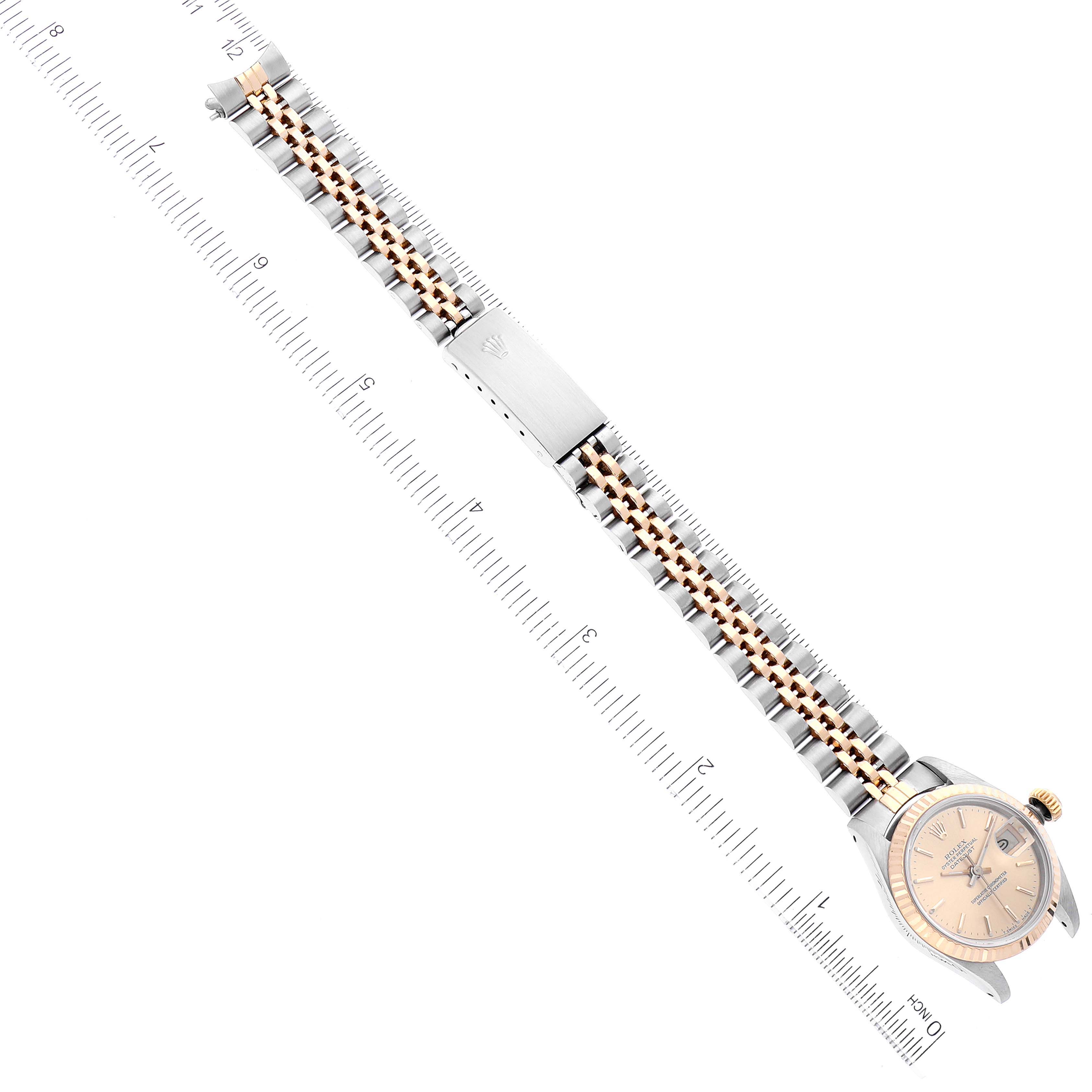 The image shows a Rolex Datejust 69173 Women's Steel and Gold (two tone) Champagne Dial 69173 Women's Steel and Gold (two tone) Champagne Dial watch with an integrated two-tone bracelet and a partially visible dial, taken from an aerial view.