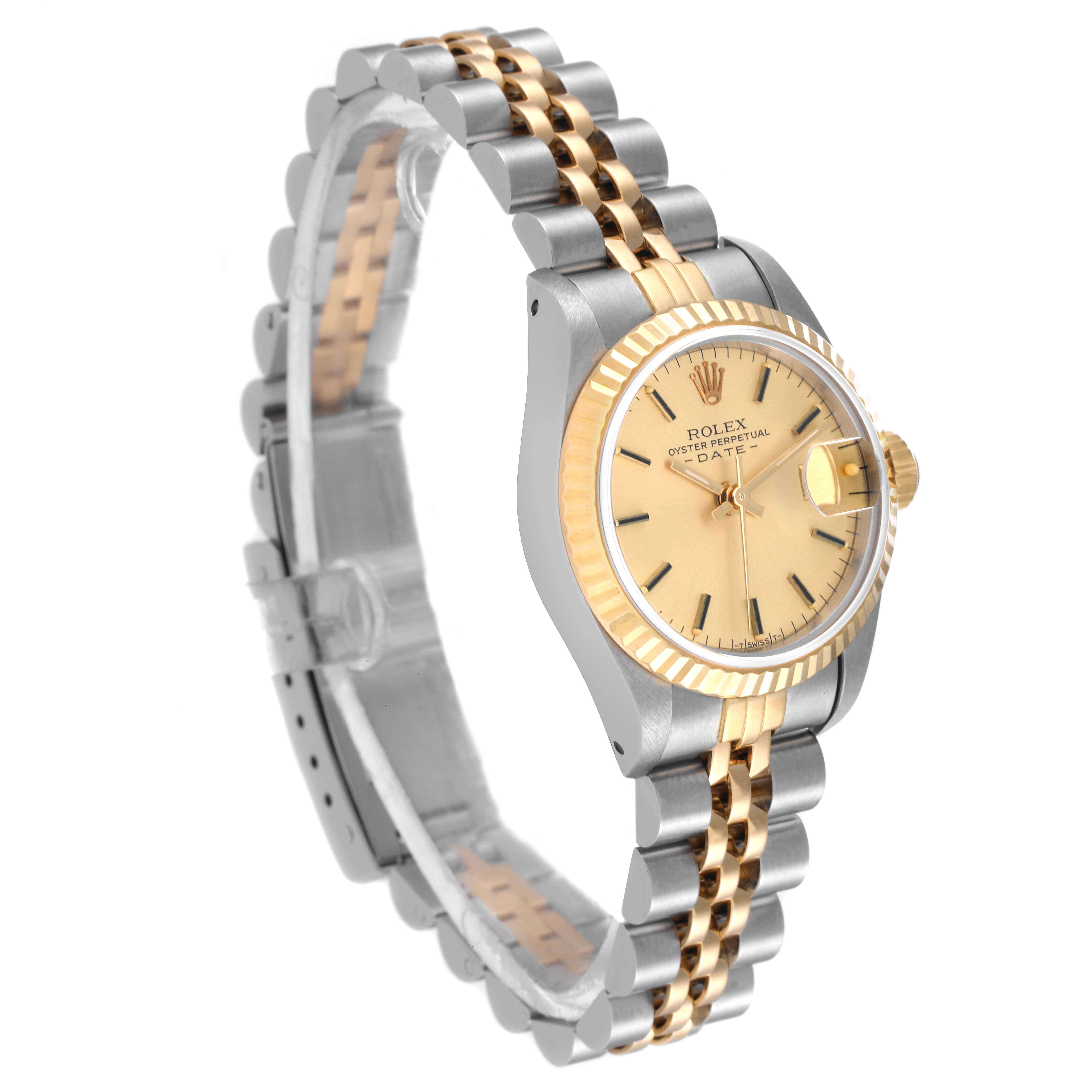 The image shows a Rolex Datejust 69173 Women's Steel and Gold (two tone) Champagne Dial 69173 Women's Steel and Gold (two tone) Champagne Dial watch at an oblique angle, highlighting the gold and silver bracelet, dial, and fluted bezel.