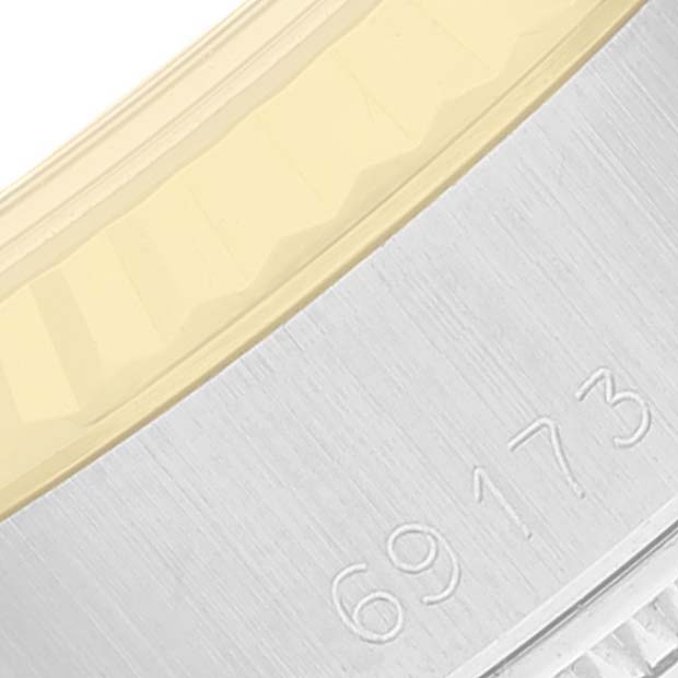 This close-up image shows the side view of the bezel and case, with the model number visible of a Rolex Datejust 69173 Women's Steel and Gold (two tone) Champagne Dial 69173 Women's Steel and Gold (two tone) Champagne Dial watch.