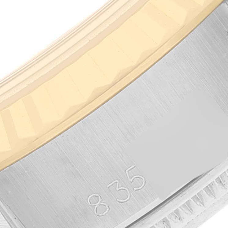 The image shows a close-up of the bezel and side case of a Rolex Datejust 69173 Women's Steel and Gold (two tone) Champagne Dial 69173 Women's Steel and Gold (two tone) Champagne Dial watch.