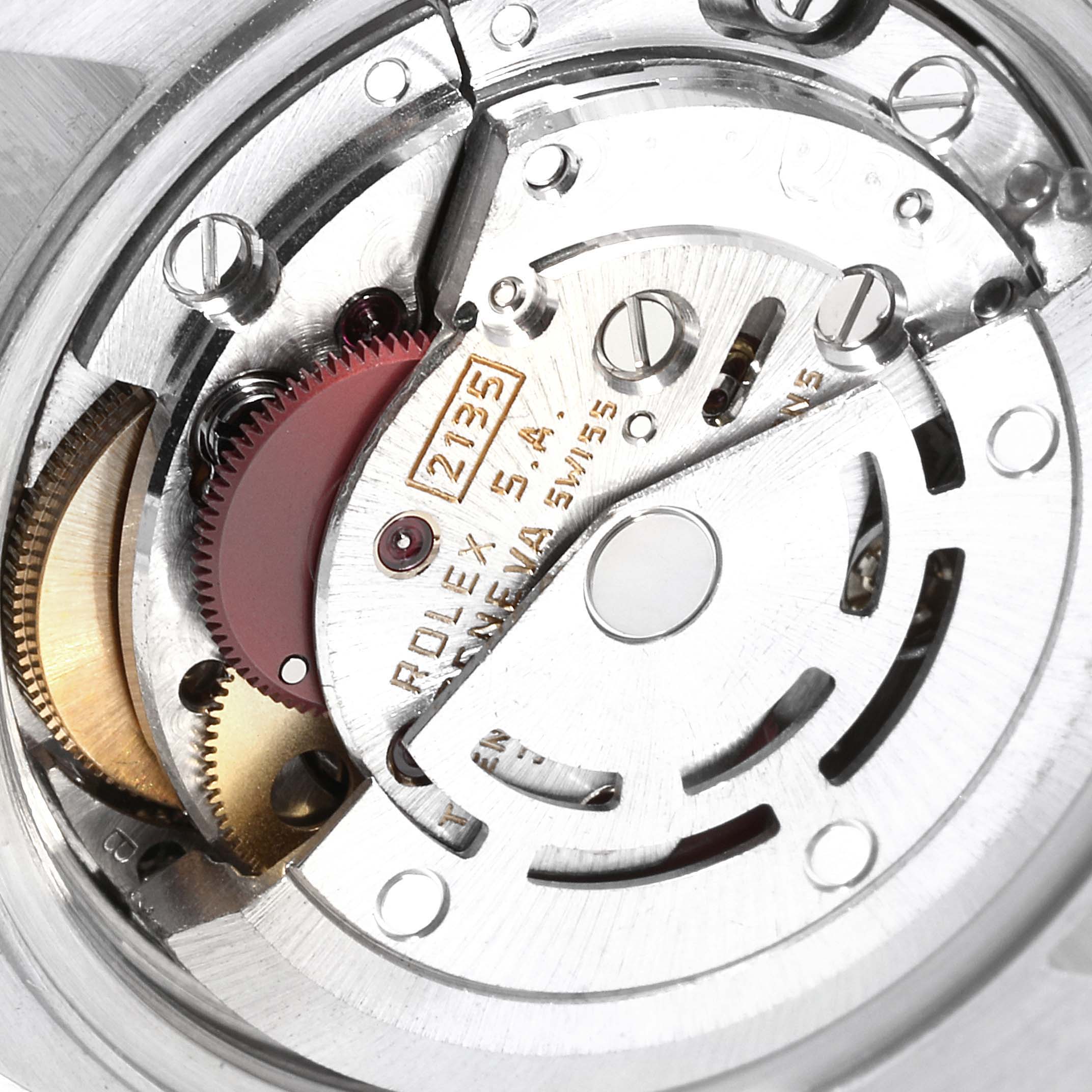 The image shows a close-up view of the movement mechanism of a Rolex Oyster Perpetual 69173 Women
s Steel and Gold (two tone) Champagne Dial 69173 Women
s Steel and Gold (two tone) Champagne Dial watch.