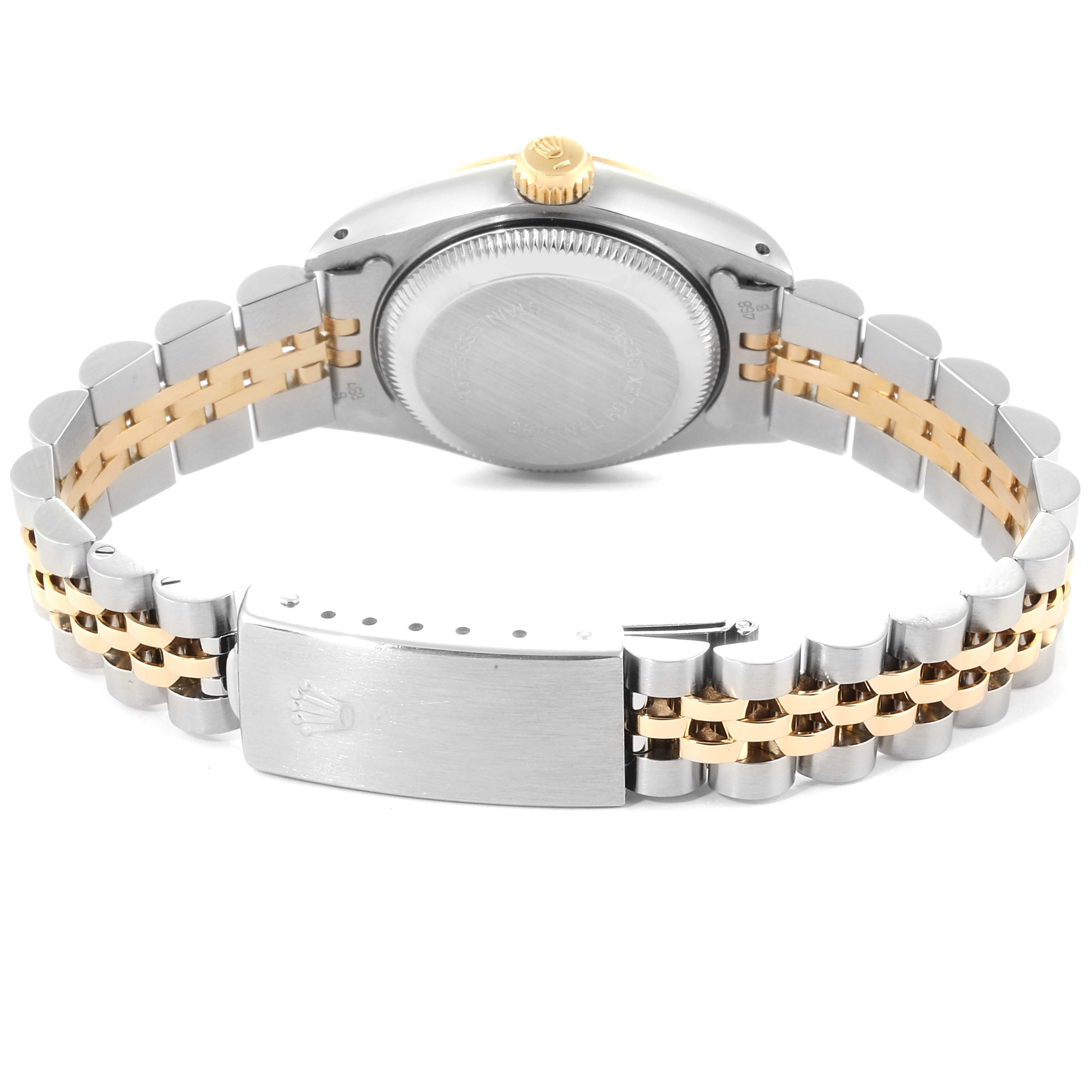 The image shows the back view of a Rolex Oyster Perpetual 69173 Women
s Steel and Gold (two tone) Champagne Dial 69173 Women
s Steel and Gold (two tone) Champagne Dial watch, highlighting the case back, crown, and two-tone bracelet.