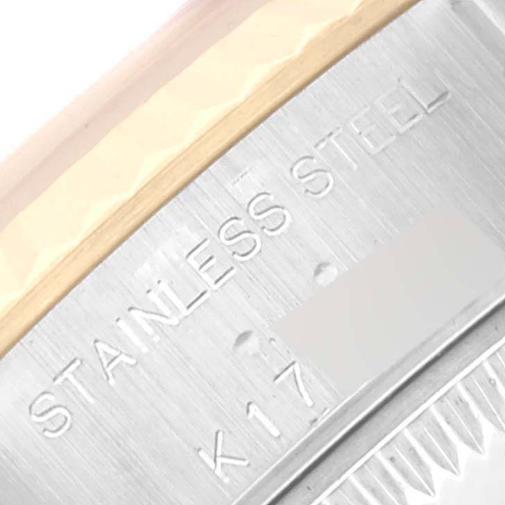 The image shows an up-close view of the stainless steel casing of a Rolex Datejust 79173 Women's Steel and Gold (two tone) White Dial 79173 Women's Steel and Gold (two tone) White Dial watch.