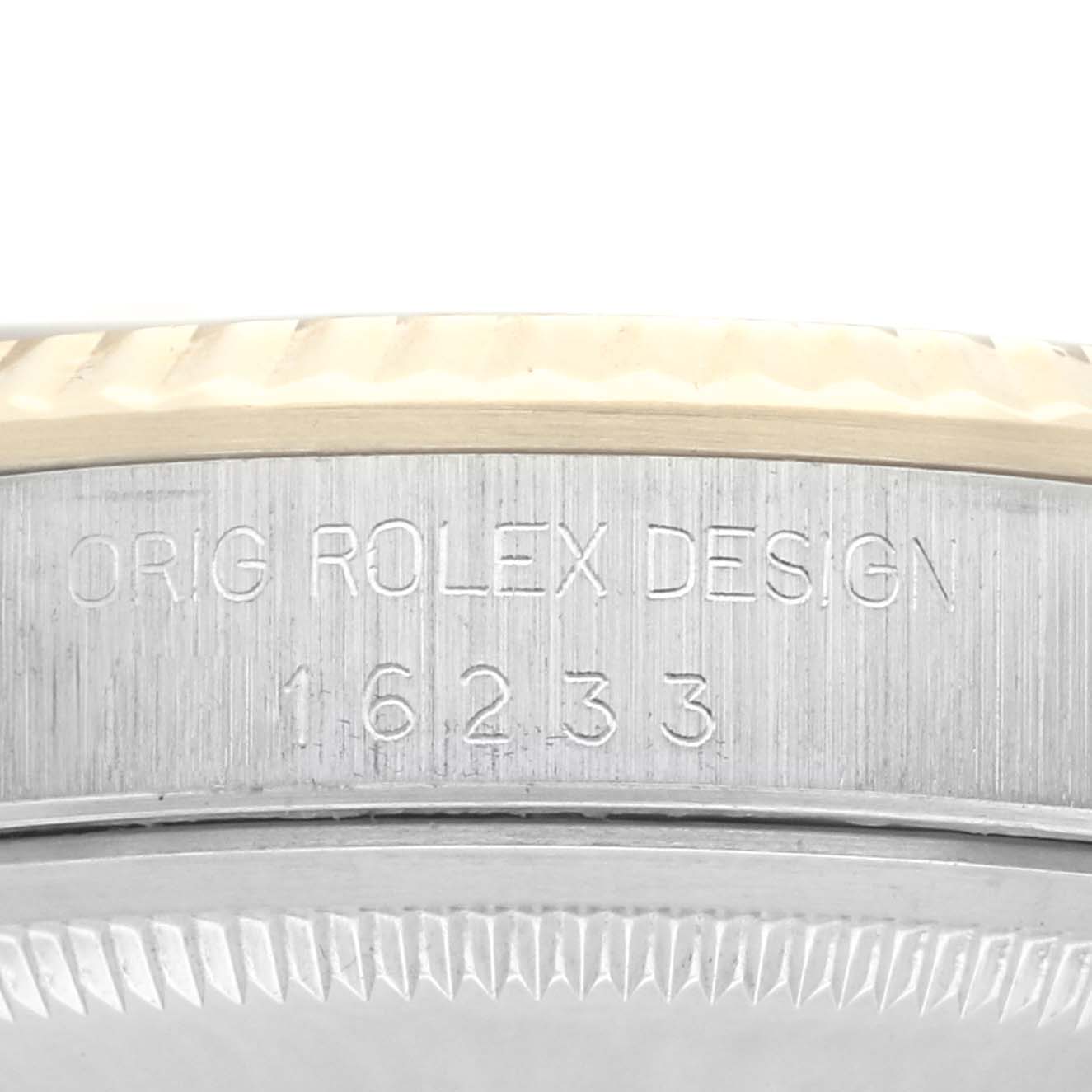 The image shows a close-up of the case side of a Rolex Datejust 16233 Men
s Steel and Gold (two tone) Champagne Dial, focusing on the engraved model number.