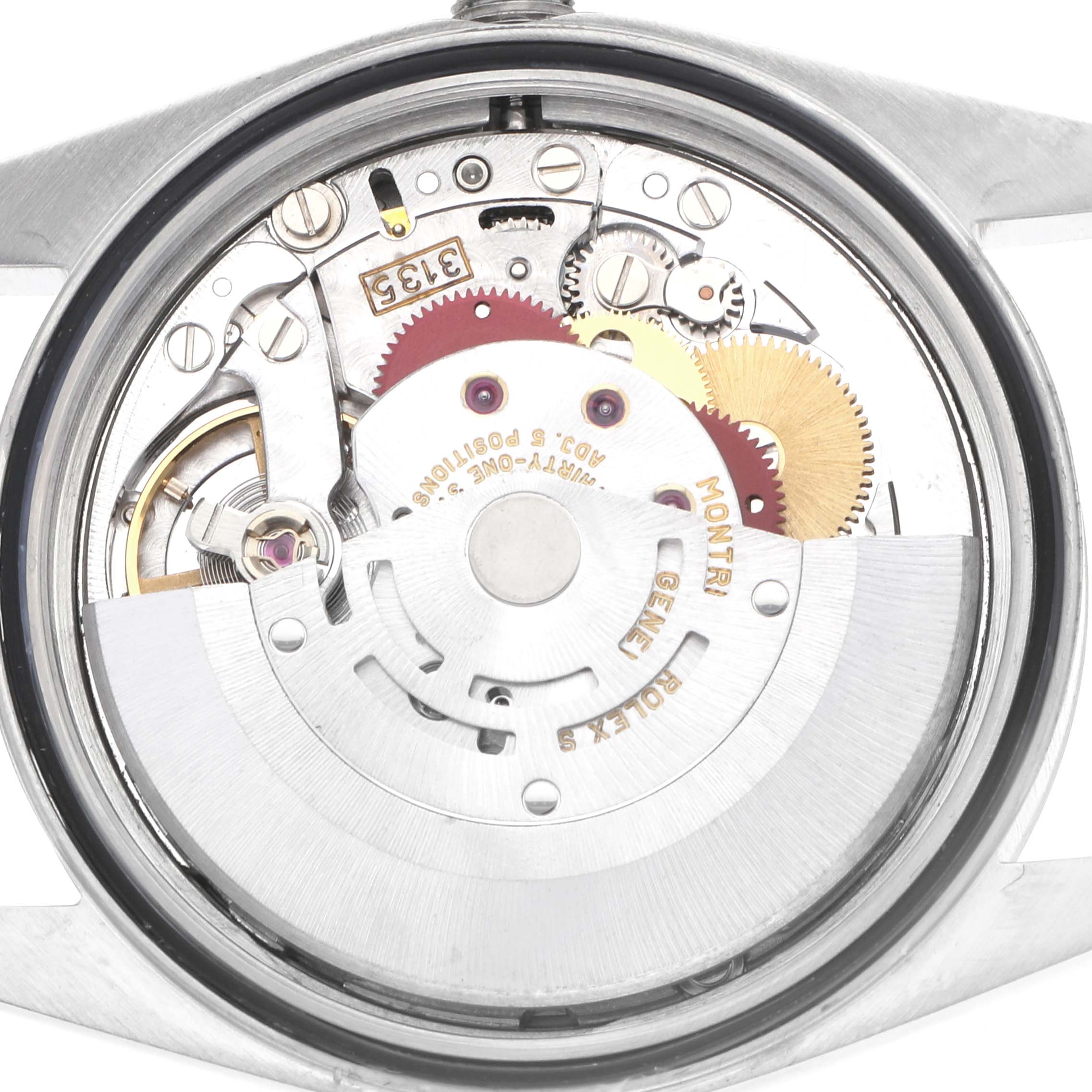 The image shows the back view of a Rolex Datejust 16233 Men
s Steel and Gold (two tone) Champagne Dial, highlighting its internal mechanical movement and gears.