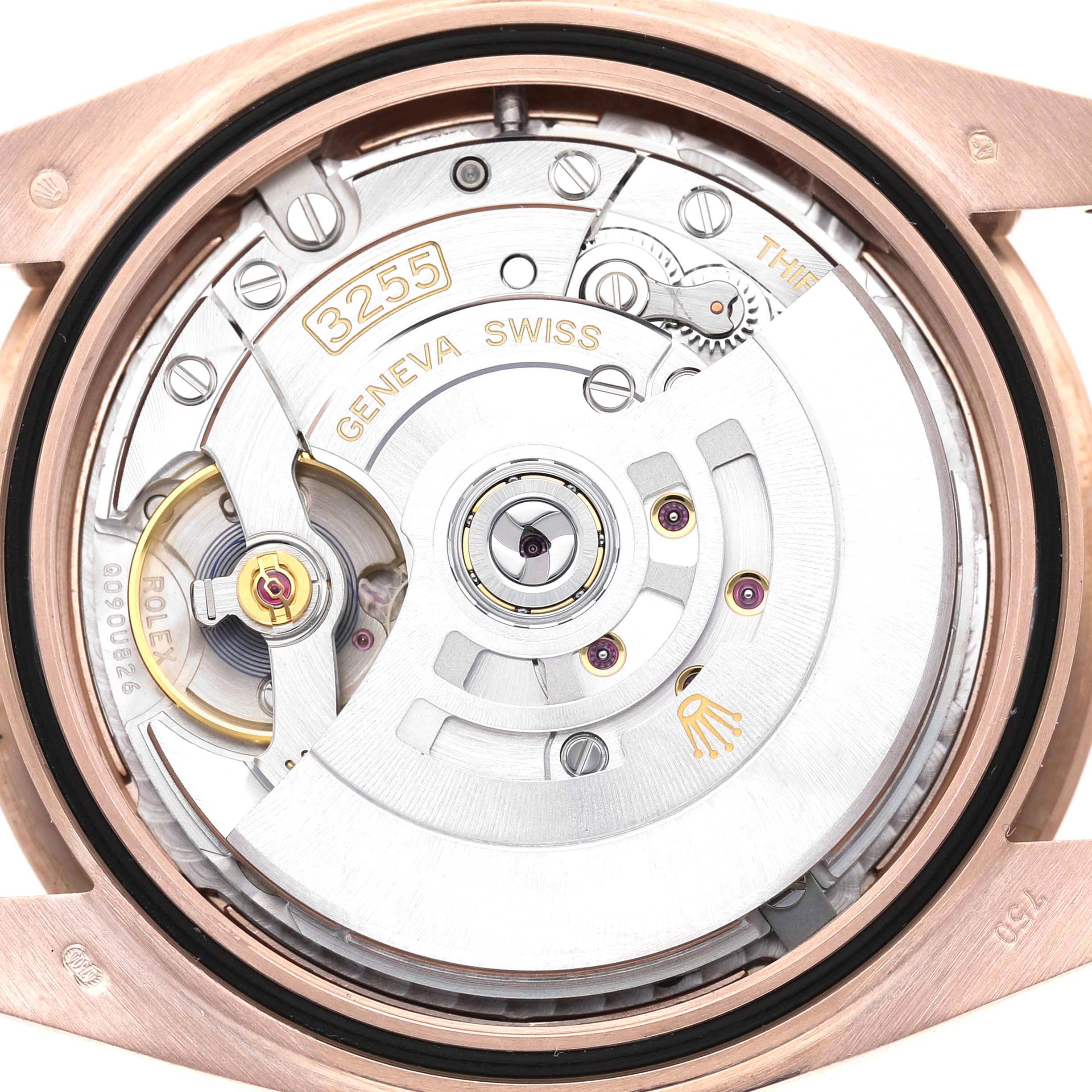 The image shows the movement of a Rolex President 228345 Men's Rose Gold Pink Dial model watch, viewed from the back, highlighting the rotor and internal mechanisms.