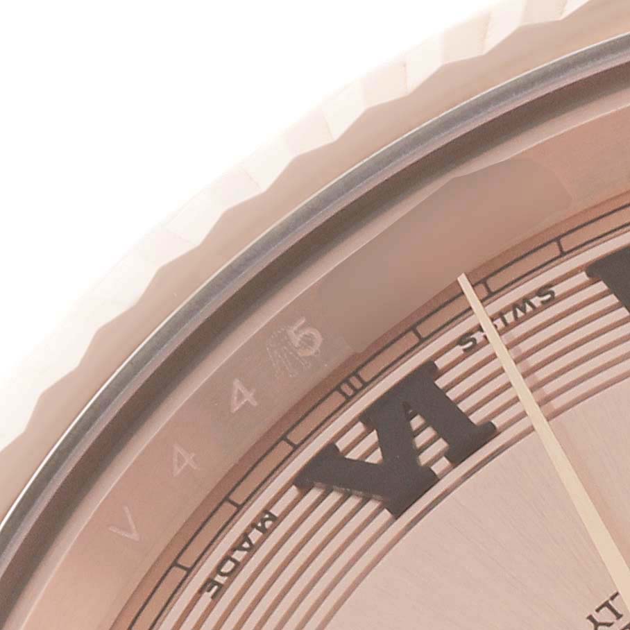 This close-up shows the face and bezel of the Rolex President 218235 Men's Rose Gold Champagne Dial 218235 Men's Rose Gold Champagne Dial model watch, specifically the "SWISS" marking and Roman numerals.