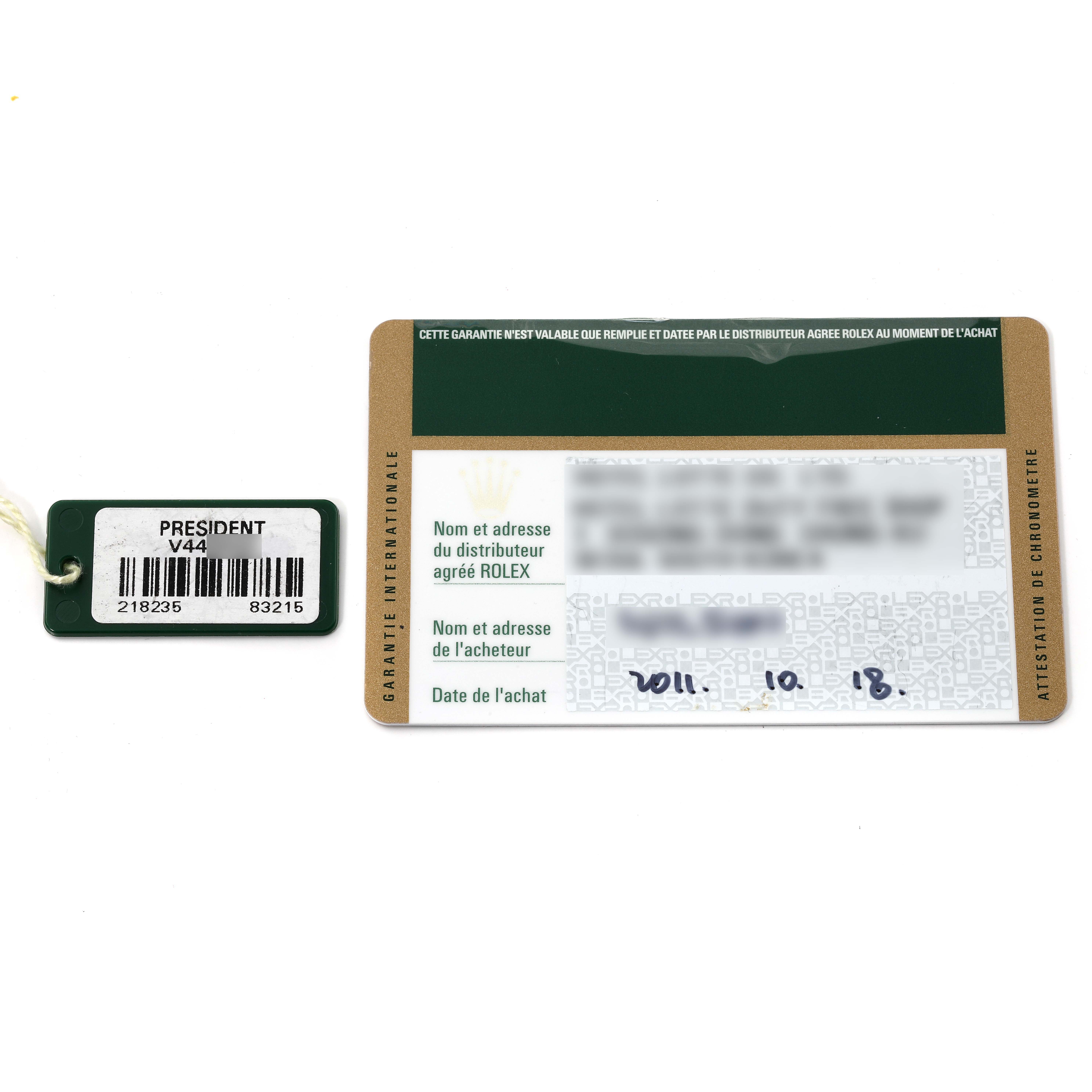 The image shows a warranty card and a tag for a Rolex President 218235 Men's Rose Gold Champagne Dial 218235 Men's Rose Gold Champagne Dial model watch.