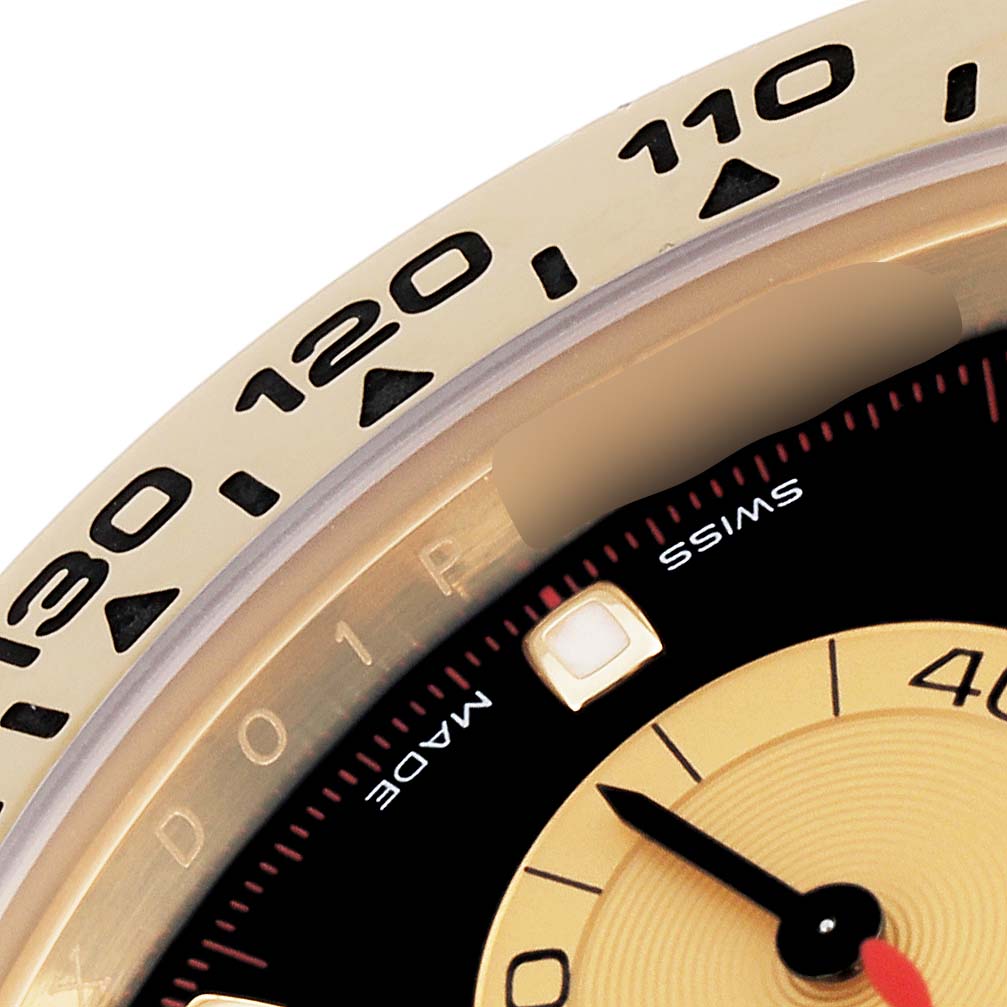 The image shows a close-up of the dial and bezel of a Rolex Daytona 116508 Men's Yellow Gold Black Dial 116508 Men's Yellow Gold Black Dial watch with partial visibility of its tachymeter scale.
