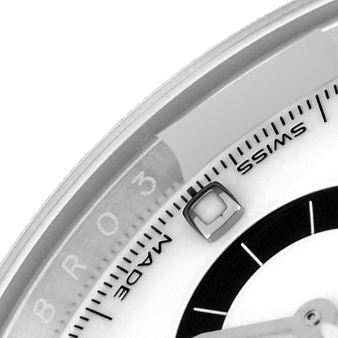 This image shows a close-up of the dial of a Rolex Daytona 116500 Men
s Stainless Steel White Dial 116500 Men
s Stainless Steel White Dial, highlighting the "Swiss Made" text and the edge of the watch face.