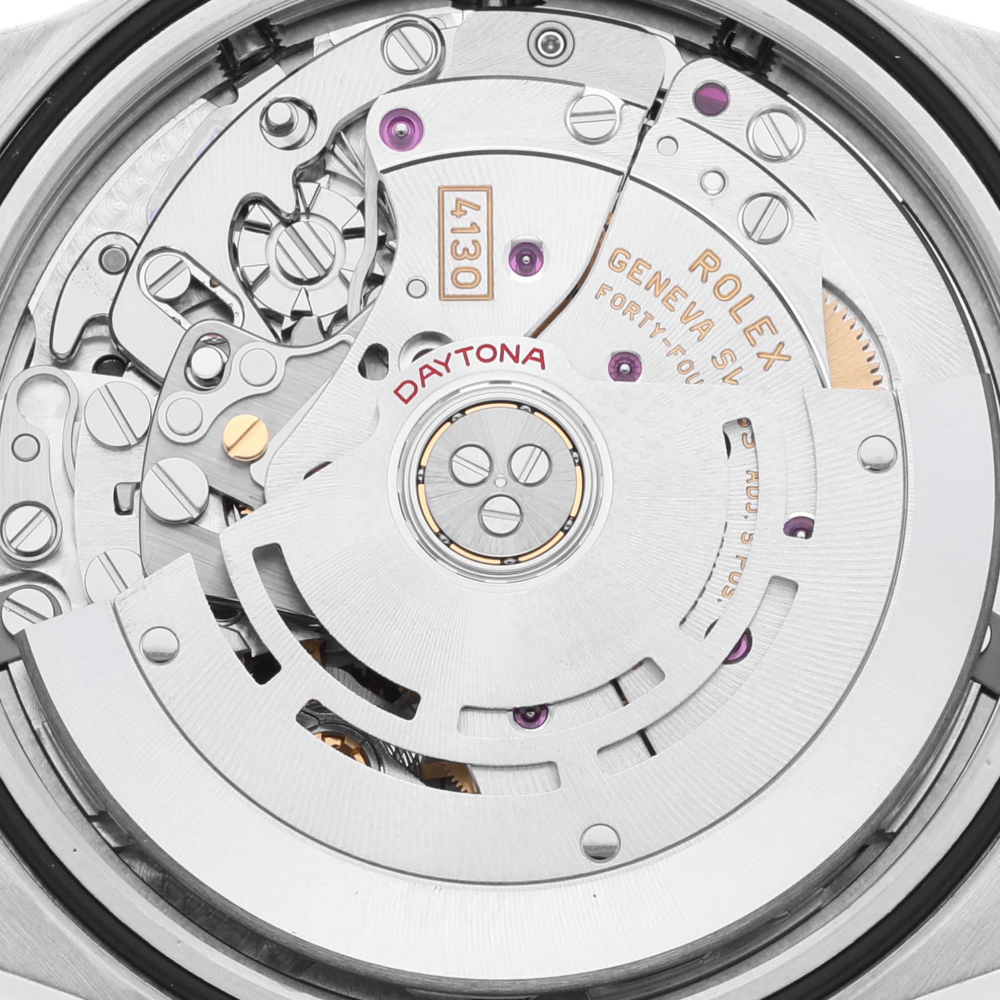 The image shows the movement of a Rolex Daytona 116500 Men
s Stainless Steel White Dial 116500 Men
s Stainless Steel White Dial watch, displaying intricate gears and engravings from a close-up angle.