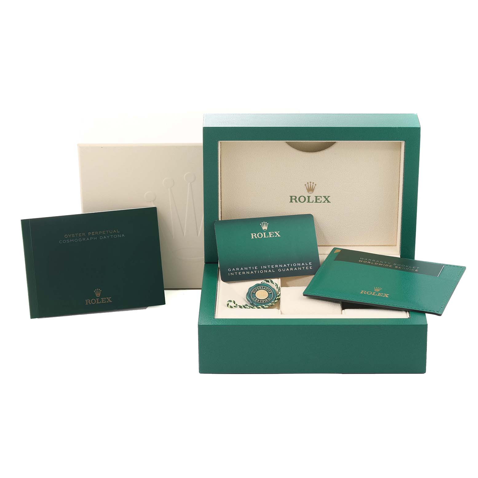 The image shows the packaging and accessories of a Rolex Daytona 116500 Men
s Stainless Steel White Dial 116500 Men
s Stainless Steel White Dial, including a box, booklet, warranty card, and tags.