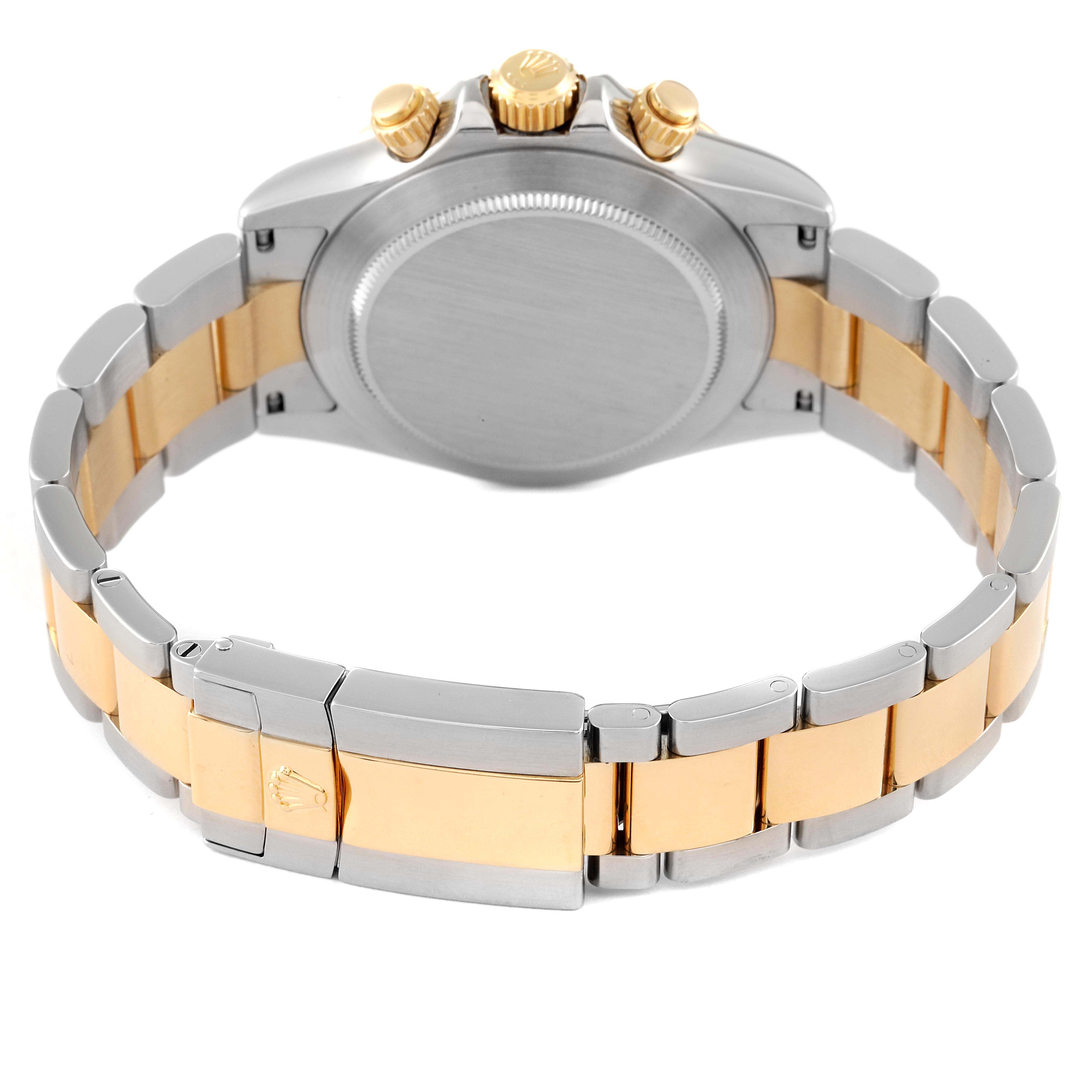 The image shows the back view of a Rolex Daytona 116523 Men's Steel and Gold (two tone) Black Dial 116523 Men's Steel and Gold (two tone) Black Dial watch, highlighting its two-tone bracelet and clasp.