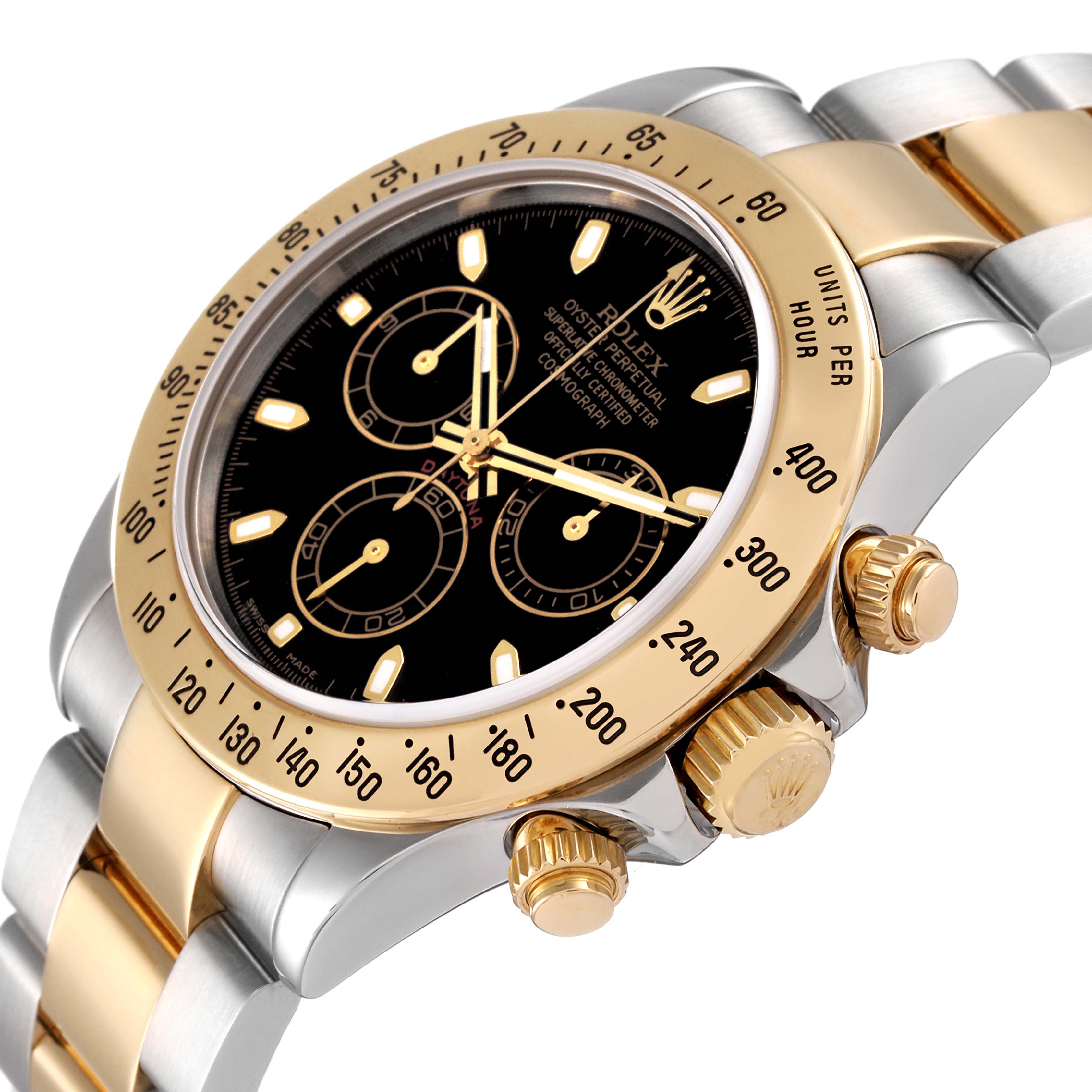 This image shows a Rolex Daytona 116523 Men's Steel and Gold (two tone) Black Dial 116523 Men's Steel and Gold (two tone) Black Dial watch at a slight angle, highlighting the bezel, dial, and crown in a close-up.